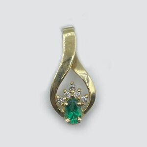 14K Yellow Gold Teardrop shaped Pendant with center oval Emerald
